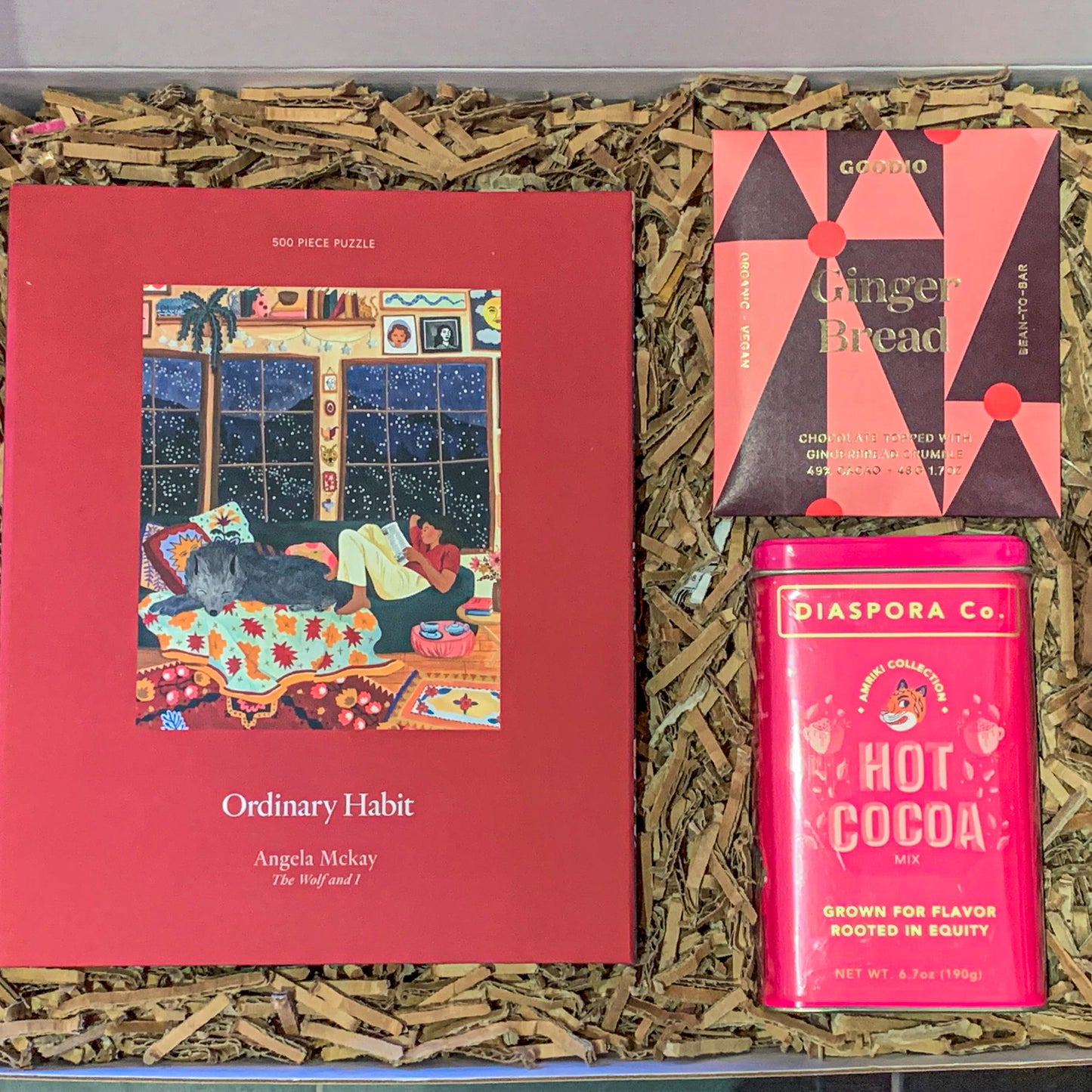 winter themed gift box with hot chocolate mix and a 500 piece winter puzzle