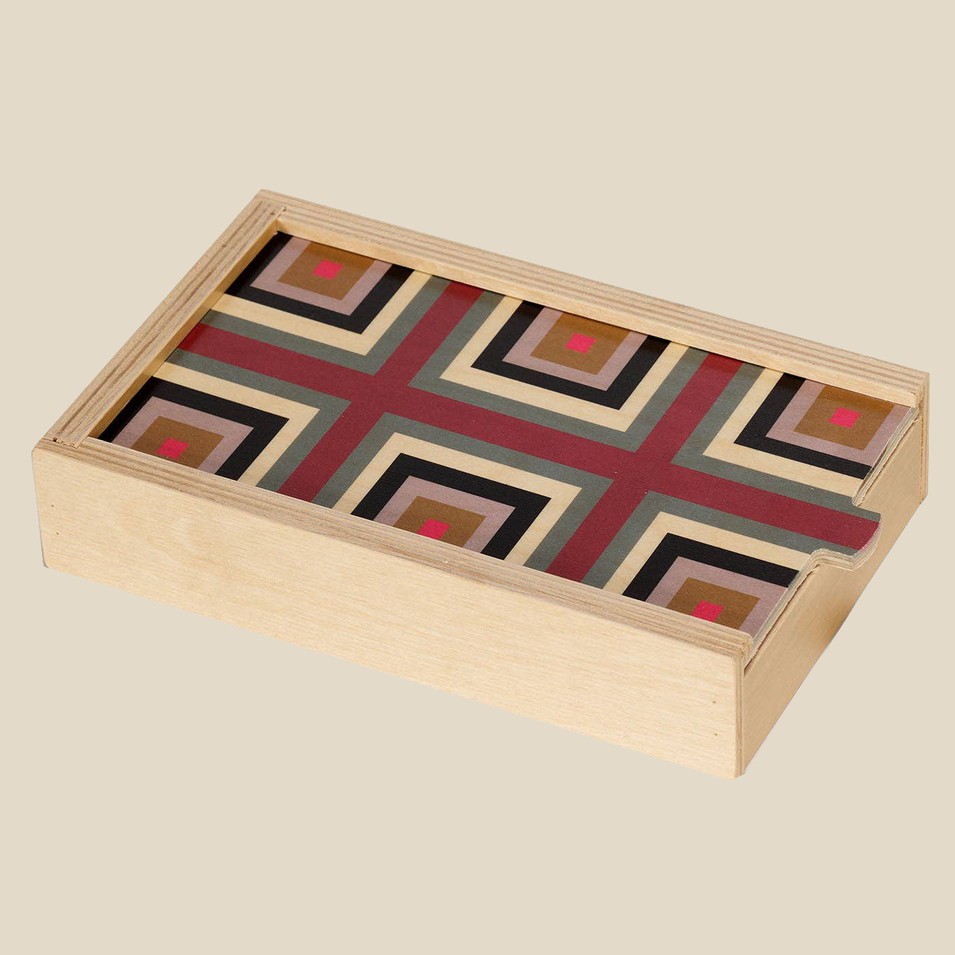 Wolfum Studio Domino Set in “Squaresville Maroon”. The Domino set is closed so you can only see the wooden birch box it comes in.