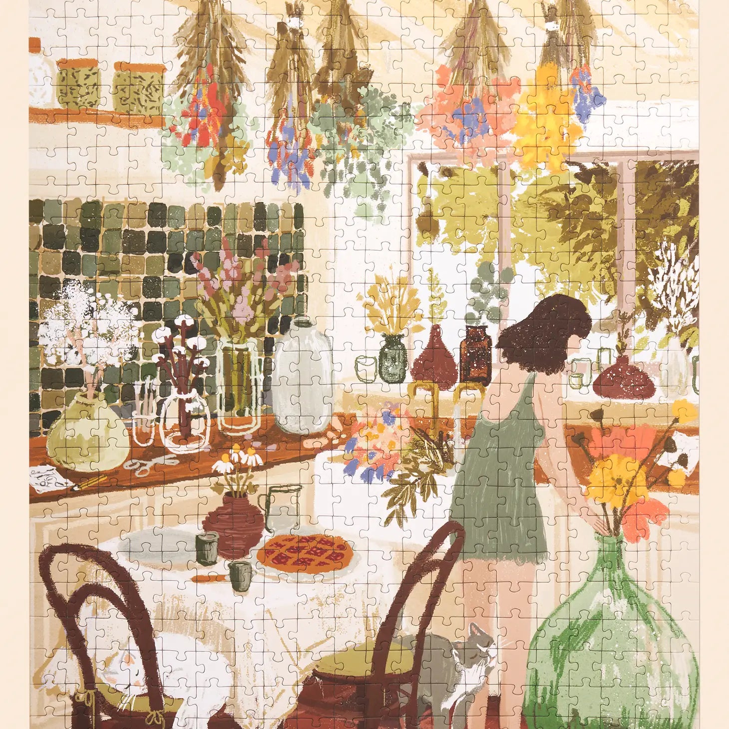 Completed "Home Flowering" Puzzle by Ordinary Habit shows a girl arranging flowers in a large glass vase in her kitchen. There are bunches of flowers drying from the ceiling and smaller vases with flowers scattered around the room.