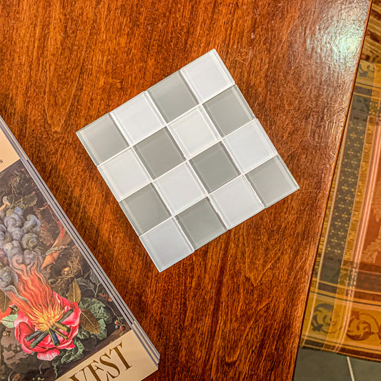 Checkered Glass Tile Coaster in Linen by Subtle Art Studios. Measures 4x4x1.5" Beige and white checker.