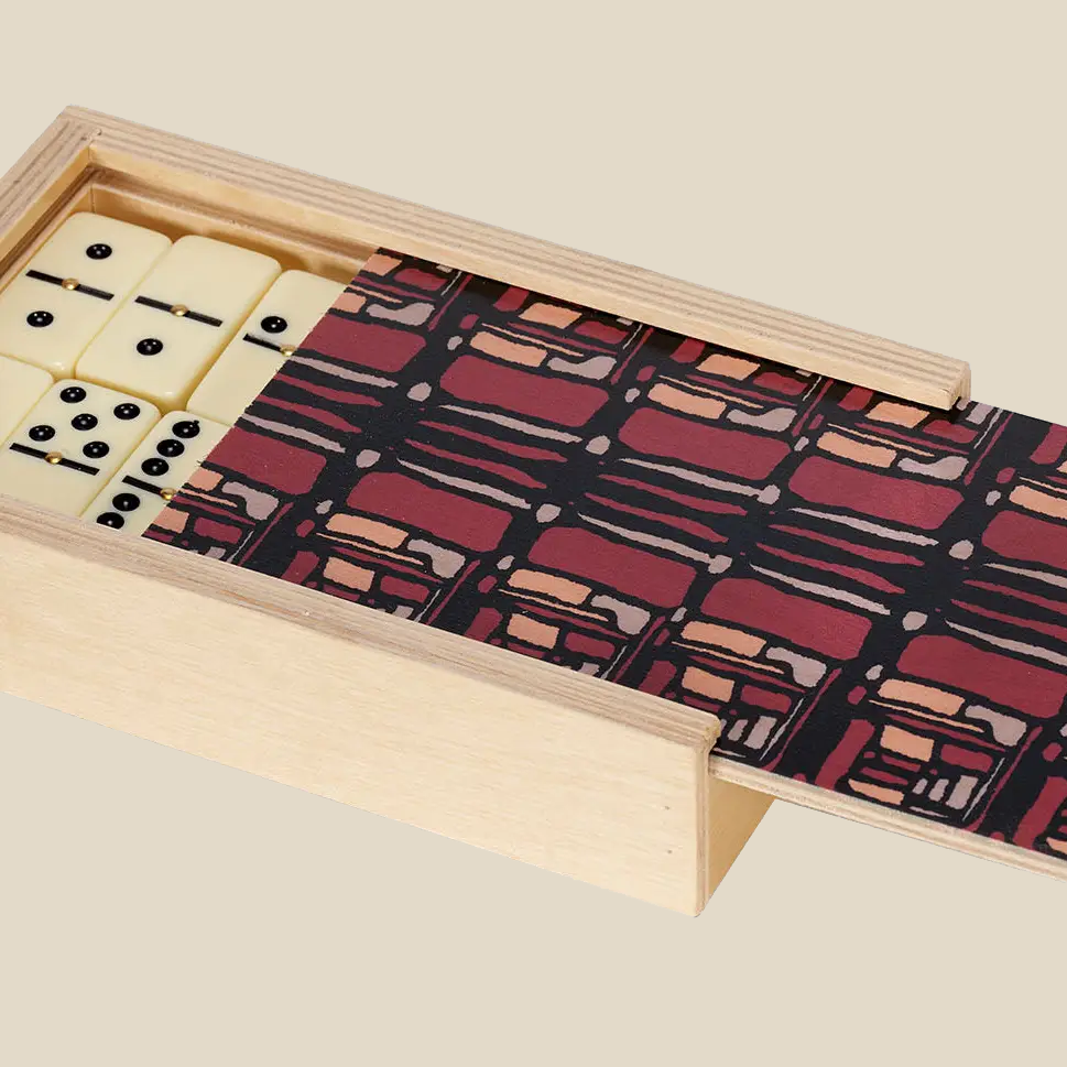 wolfum studio rue maroon domino set with the sliding top half open to show some of the dominoes inside.