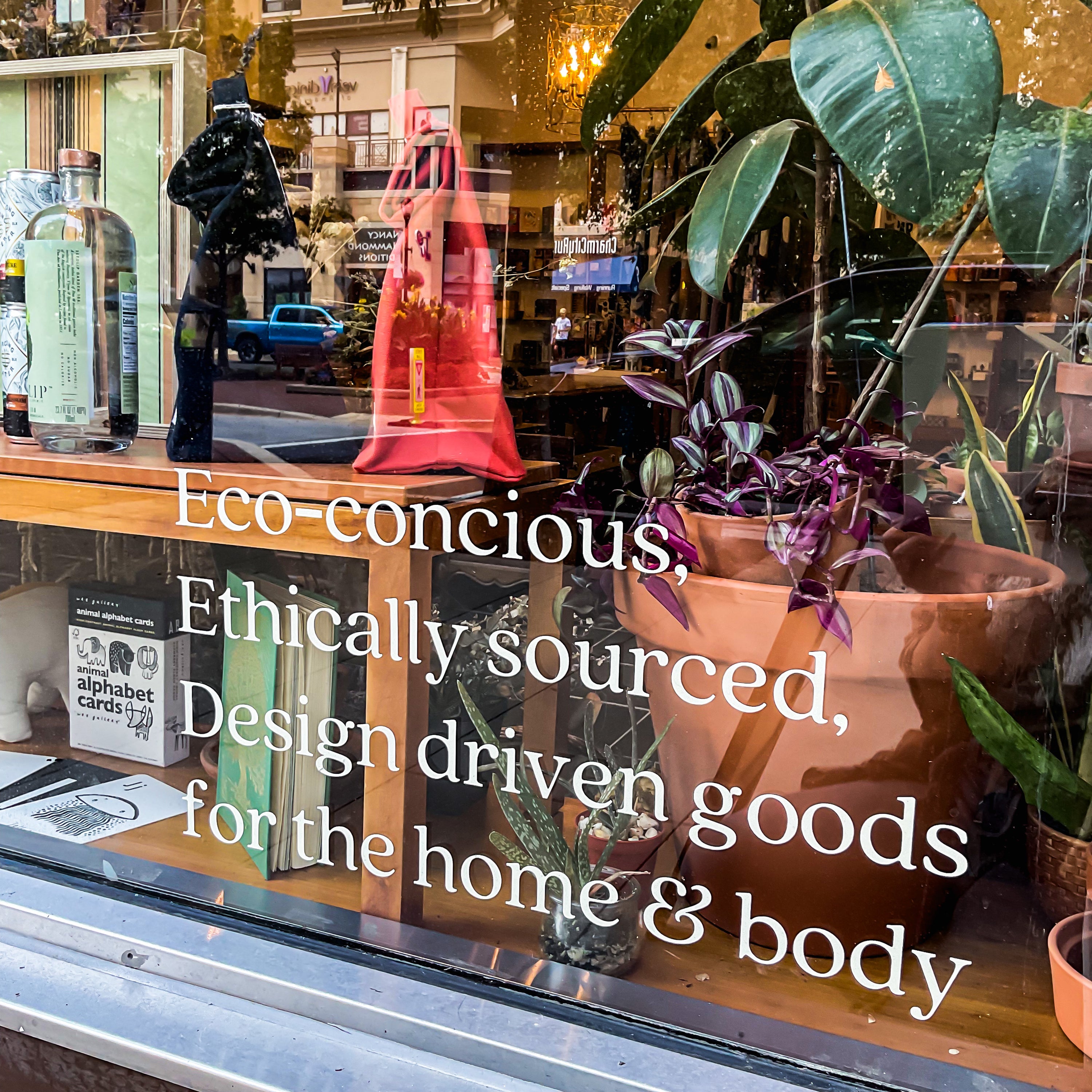 Store front window text: "Eco-conscious, Ethically sourced, Design-Driven Goods for the home & body"