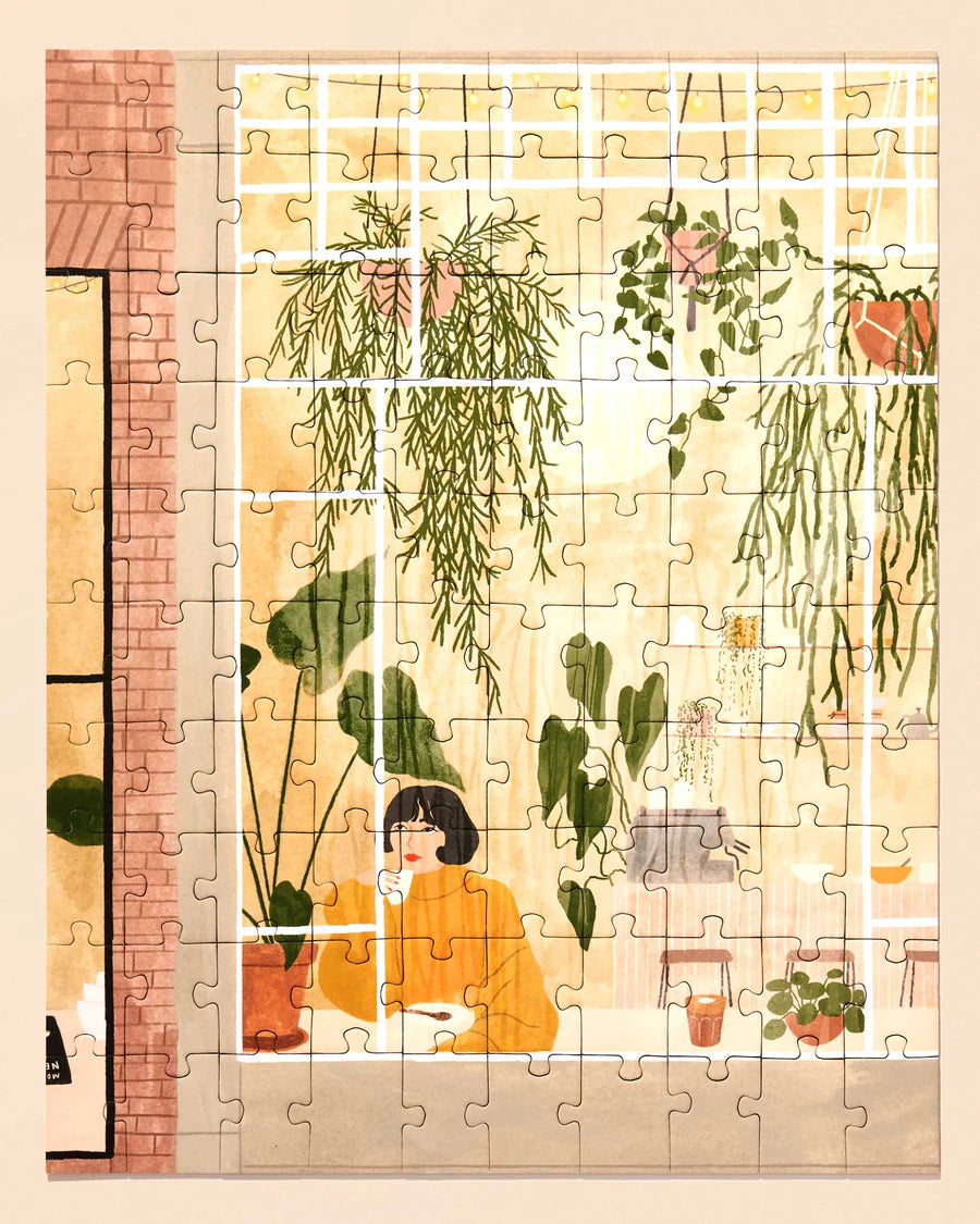 Ordinary Habit's "Sunday Coffee" Puzzle depicts a girl enjoying a cup of coffee surrounded by hanging plants 