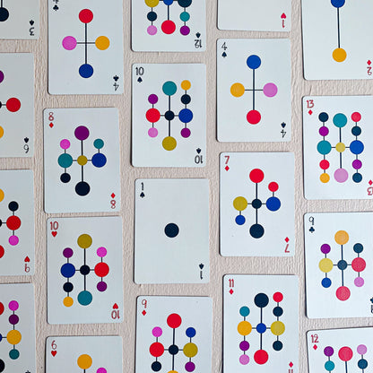 A top-fown display of cards from Art of Play's "Eames : Hang-it-All" Playing Card deck